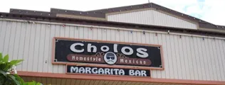 Exterior signage reading Cholo's Homestyle Mexican Restaurant & Margarita Bar at the North Shore Marketplace in Haleiwa, Hawaii
