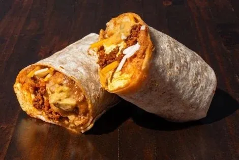 Breakfast burrito cut in half at Torchy's Tacos
