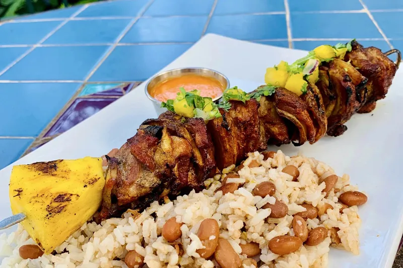 Grilled alambre de pastor skewer with rice and beans at La Fonda on Main